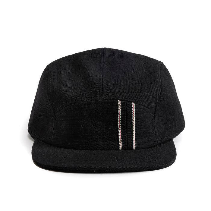 flatlay of the front of a TS x Hypeadelic cap