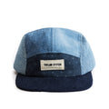 flatlay of the front of a TS x Hypeadelic cap