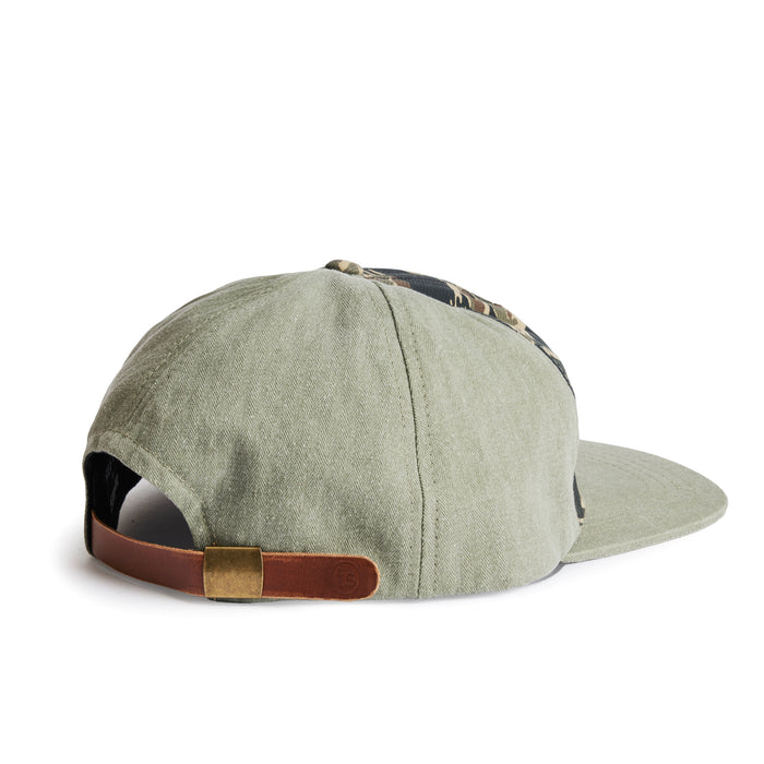 flatlay of the back of a TS x Hypeadelic cap
