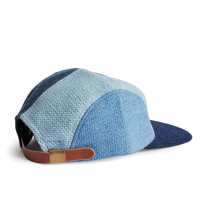 flatlay of the back of a TS x Hypeadelic cap