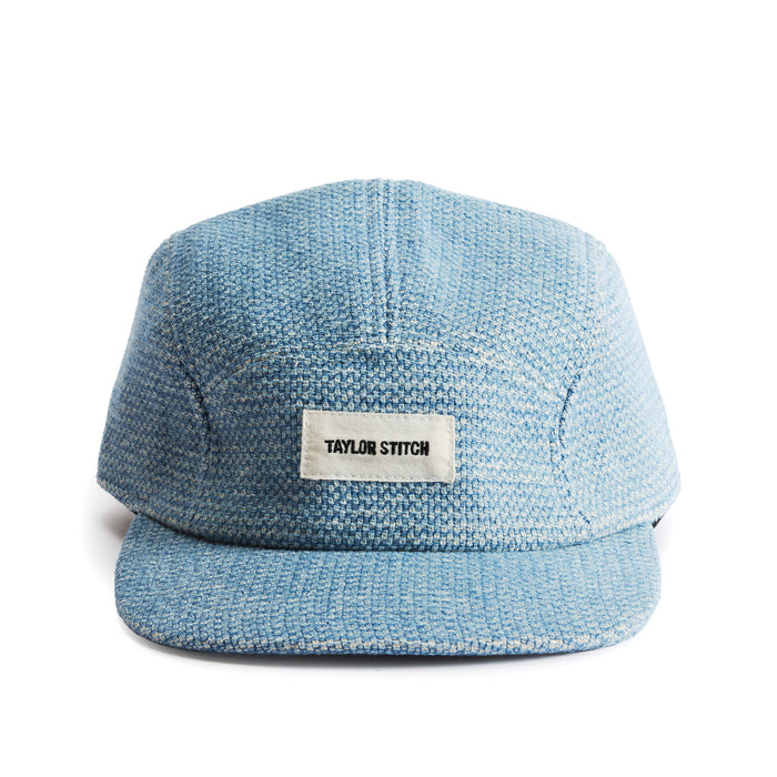flatlay of the front of a TS x Hypeadelic cap