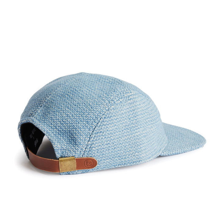 flatlay of the back of a TS x Hypeadelic cap