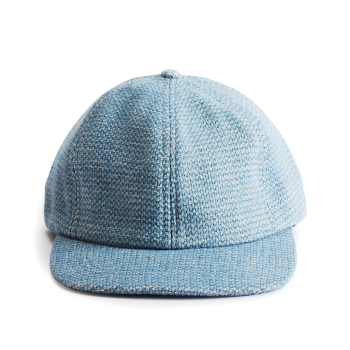 flatlay of the front of a TS x Hypeadelic cap
