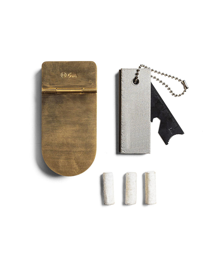 editorial image of The Tinder Box in Brass shown next to other products