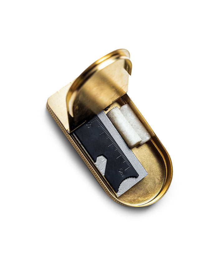editorial image of The Tinder Box in Brass opened with products inside