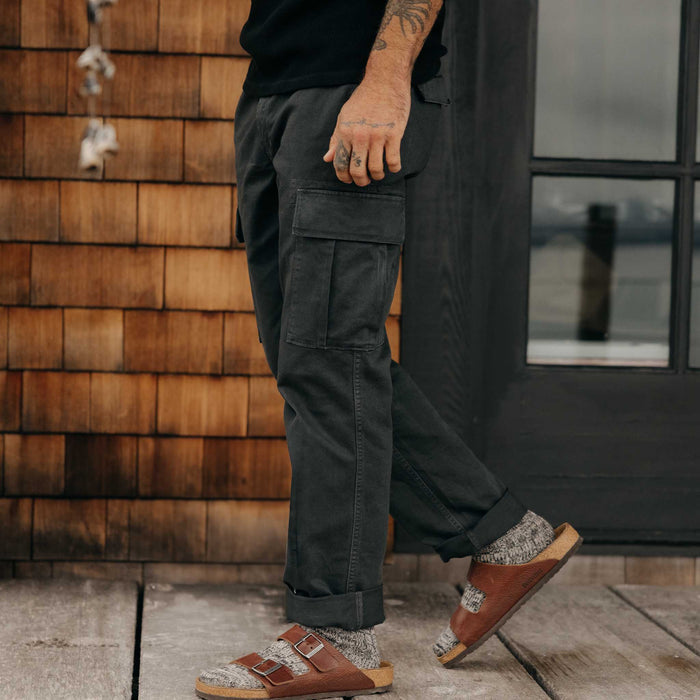 fit model walking wearing The Tommie Pant in Faded Black