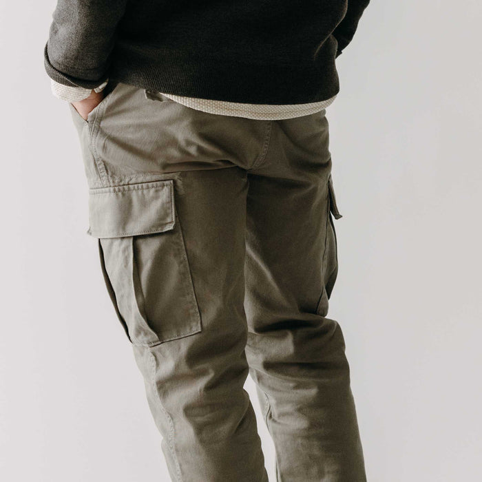 fit model showing off the back of The Tommie Pant in Fatigue Olive