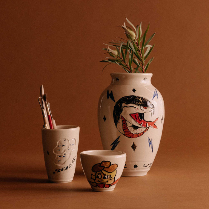 The Tough Luck Tumbler with various ceramic pieces