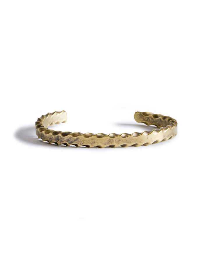 material shot of the front of The Twisted Cuff in Brass