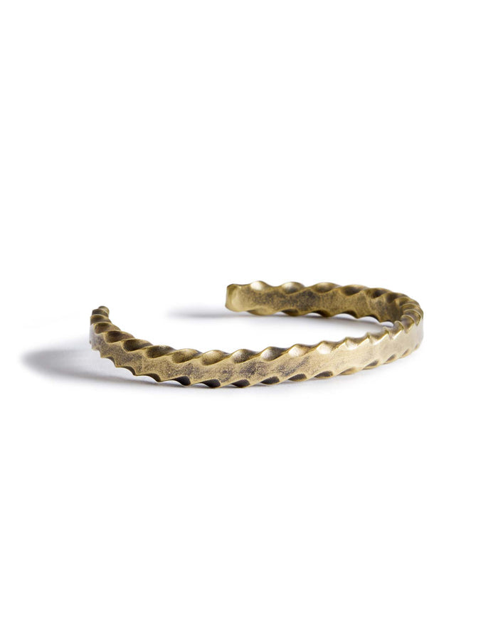 material shot of the side of The Twisted Cuff in Brass
