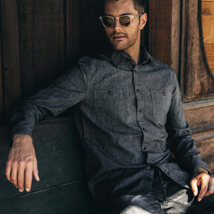 fit model sitting wearing The Utility Shirt in Ash Jaspe