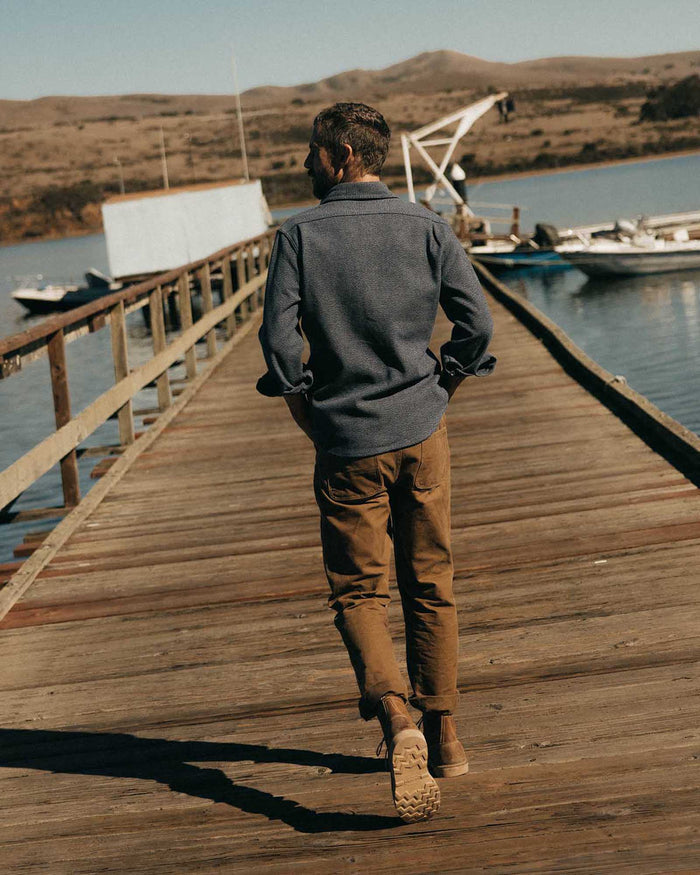 fit model walking wearing The Utility Shirt in Indigo Ash Wool Canvas