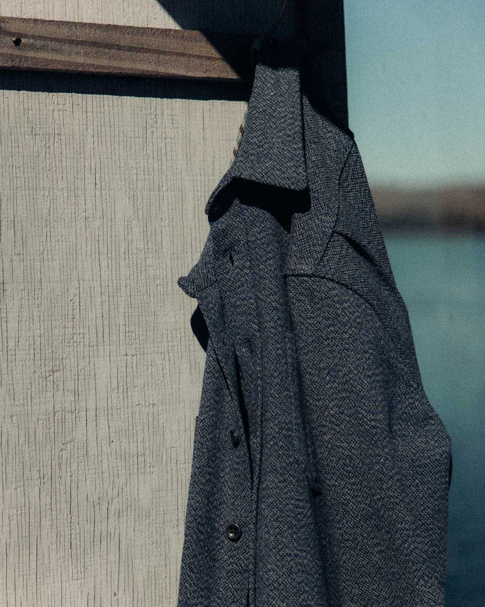 editorial image of The Utility Shirt in Indigo Ash Wool Canvas hanging