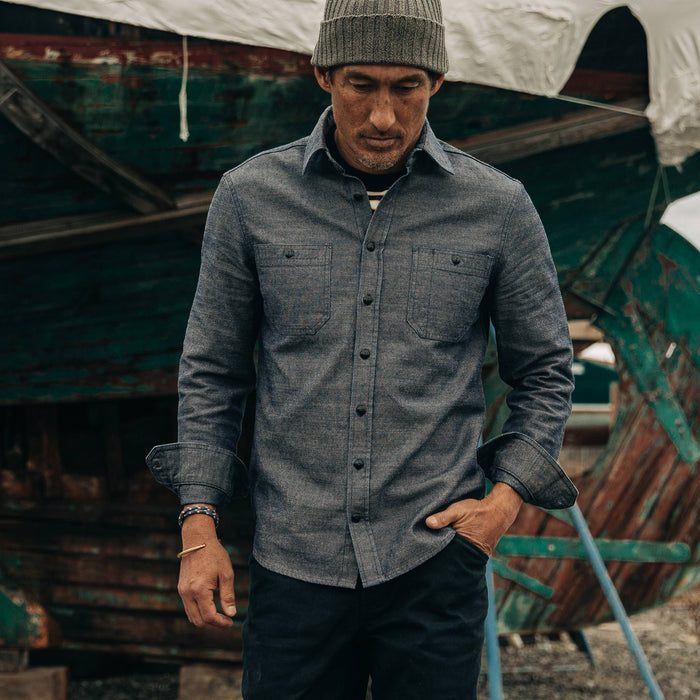 fit model rocking The Utility Shirt in Indigo Crosshatch, walking in boat yard