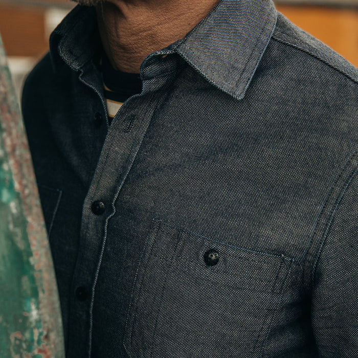 fit model rocking The Utility Shirt in Indigo Crosshatch, left chest detail