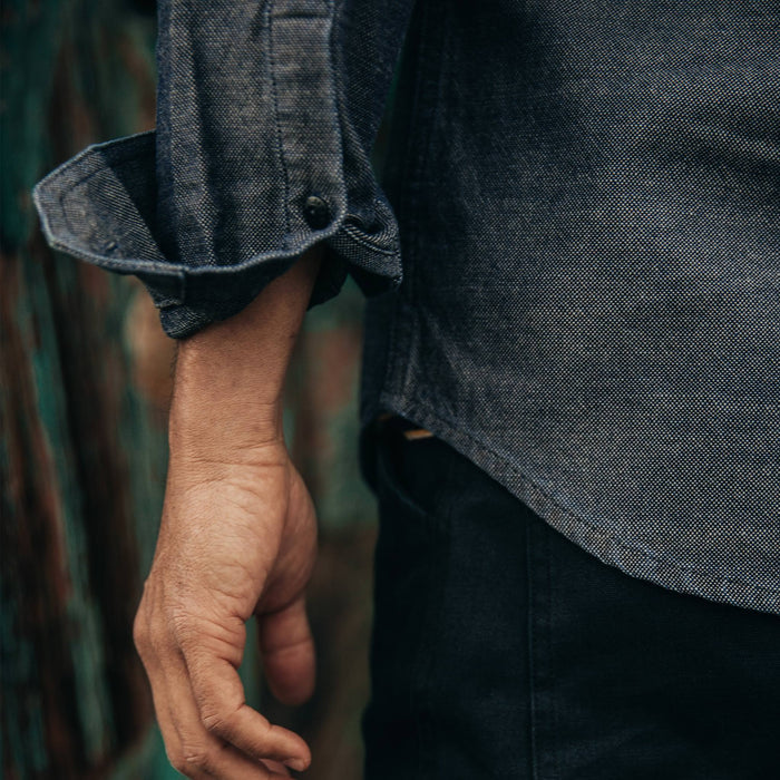 fit model rocking The Utility Shirt in Indigo Crosshatch, cuffed sleeve