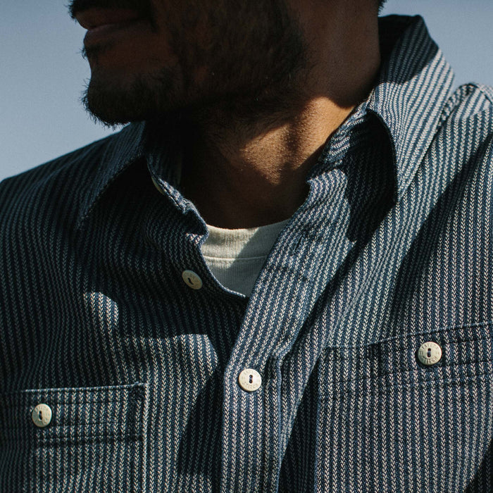Fit model wearing The Utility Shirt in Roped Indigo with a close up of the collar