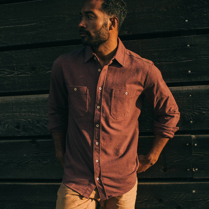 fit model adjusting hem of The Utility Shirt in Russet Heavy Bag