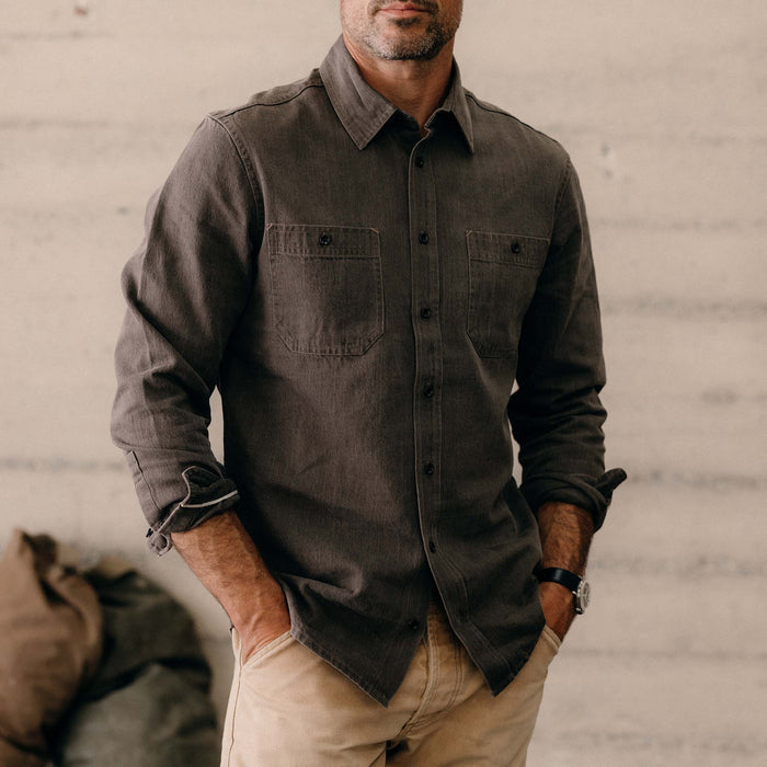 fit model with his hands in his pockets wearing The Utility Shirt in Soil Selvedge Denim