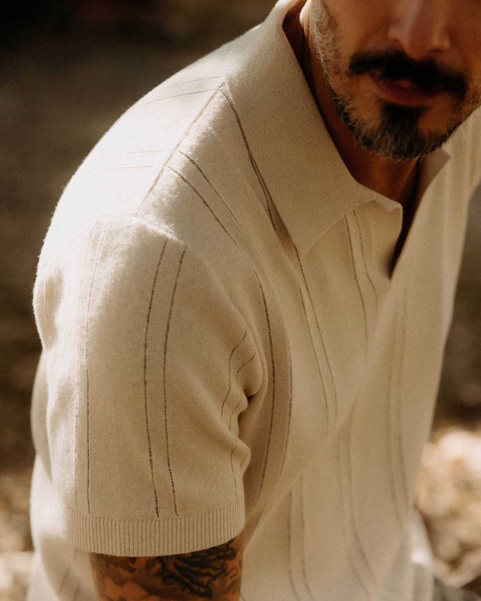 fit model showing off the rib detail on The Valencia Sweater Polo in Heather Oat Rib