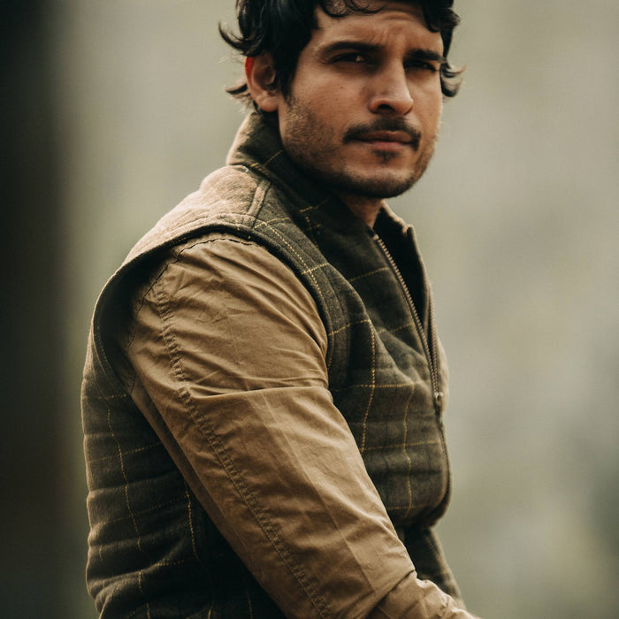 fit model wearing The Vertical Vest in Olive Plaid Wool, side shot