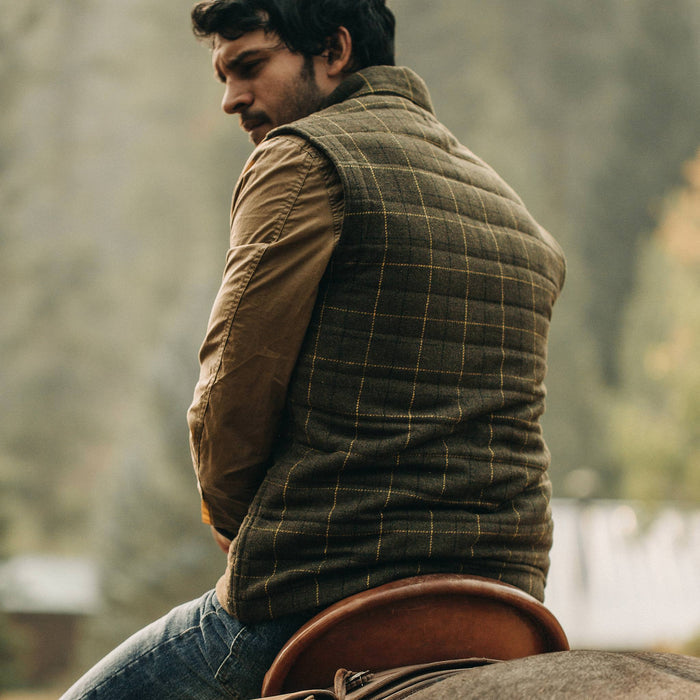 fit model wearing The Vertical Vest in Olive Plaid Wool, back shot