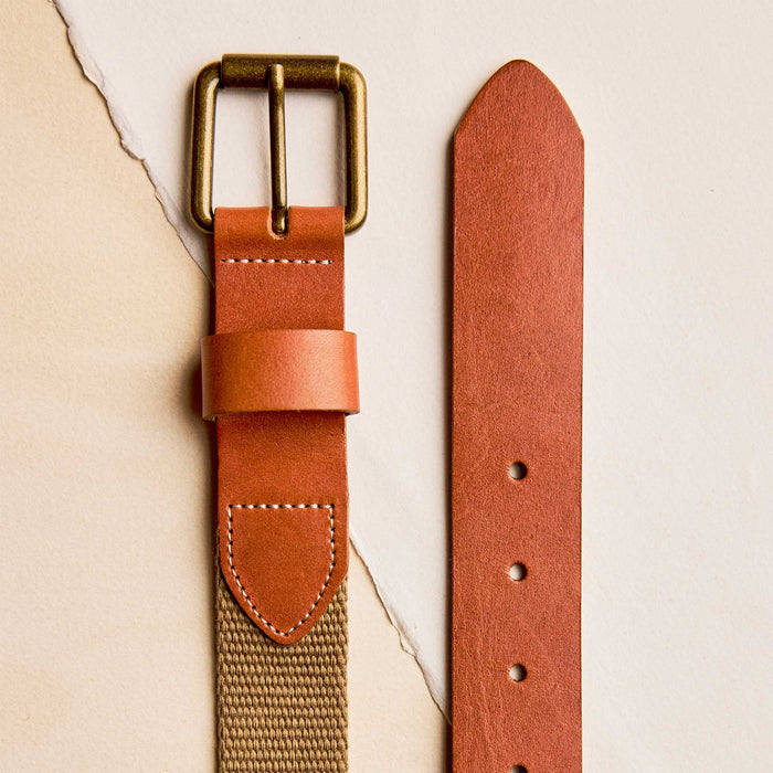 editorial flatlay of the buckle and end The Webbed Belt in Whiskey