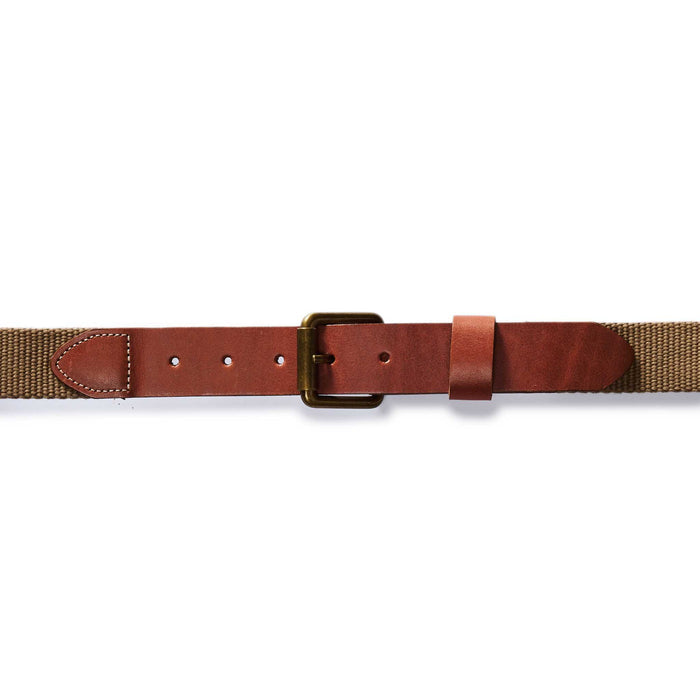 editorial flatlay of The Webbed Belt in Whiskey buckled up