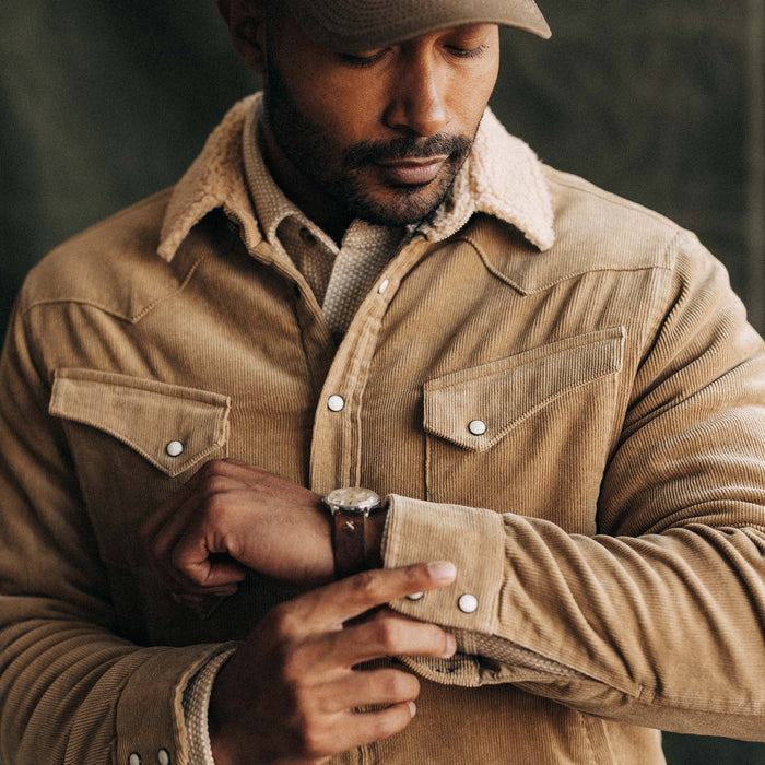 fit model adjusting the snaps on The Western Shirt Jacket in Dark Khaki Corduroy