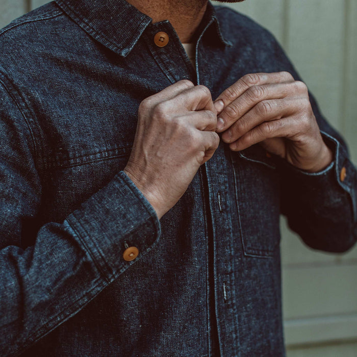 Our fit model buttoning up his jacket