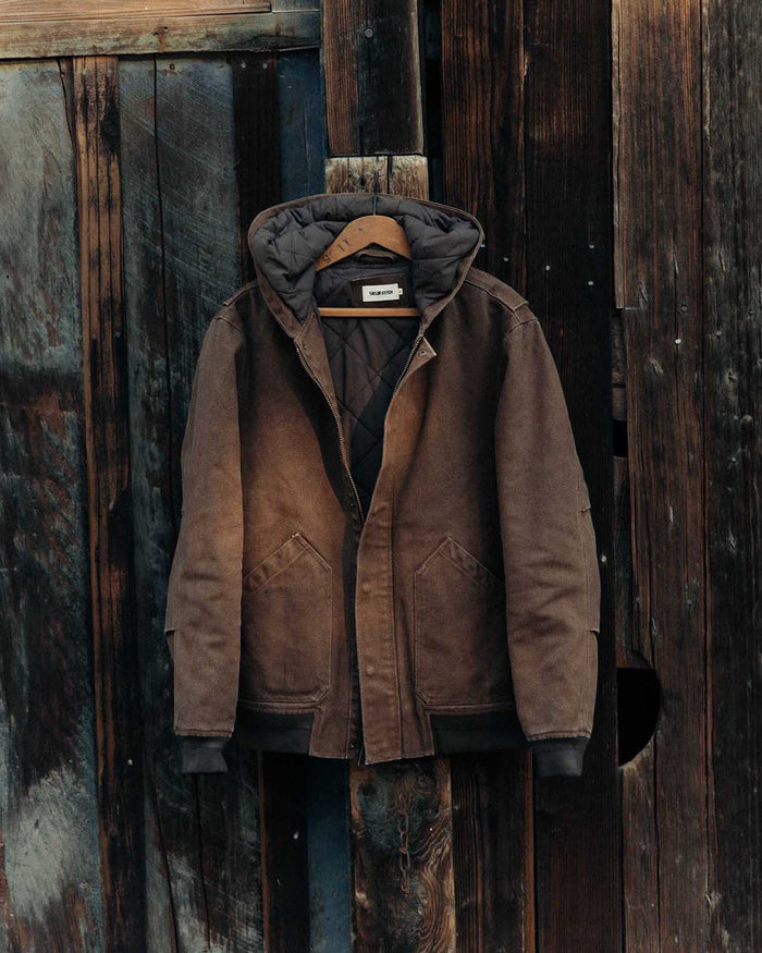 editorial image of The Workhorse Hoodie in Aged Penny Chipped Canvas hanging