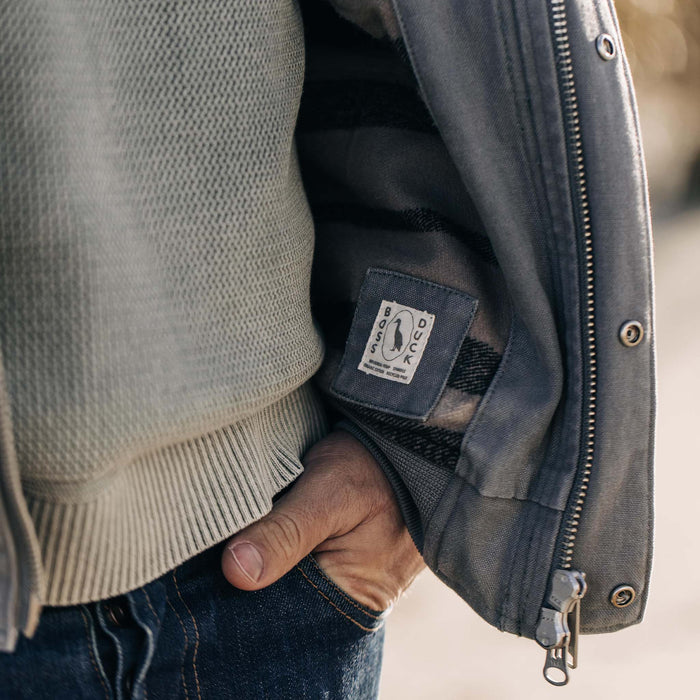 fit model showing the Boss Duck label in The Workhorse Hoodie in Gravel Boss Duck