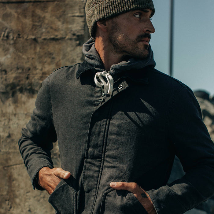 fit model wearing The Workhorse Jacket in Coal Boss Duck, looking right