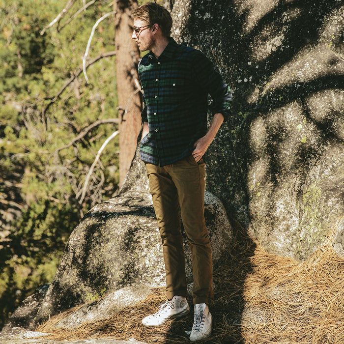 fit model next to a bouldering spot