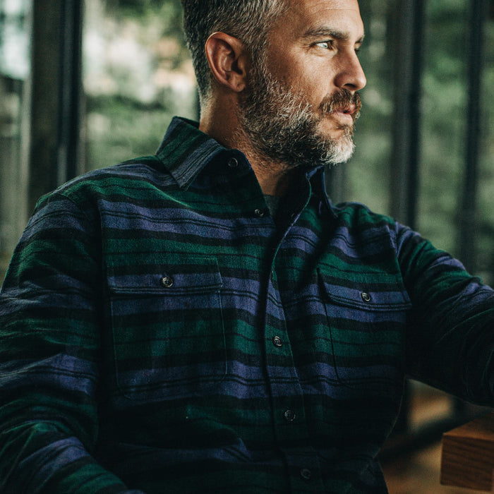 our fit model wearing The Yosemite Shirt in Blackwatch Plaid—sitting, cropped shot