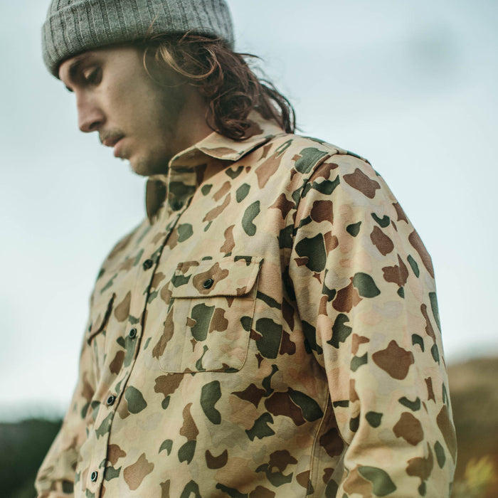 Our fit model wearing Yosemite Shirt in Camo while skateboarding