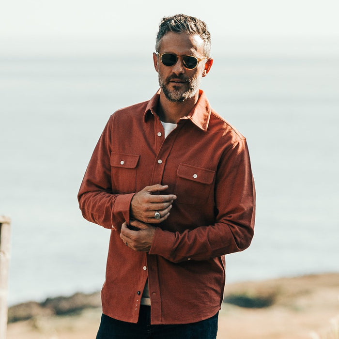 Our fit model wearing The Yosemite Shirt in Dusty Red by Taylor Stitch.