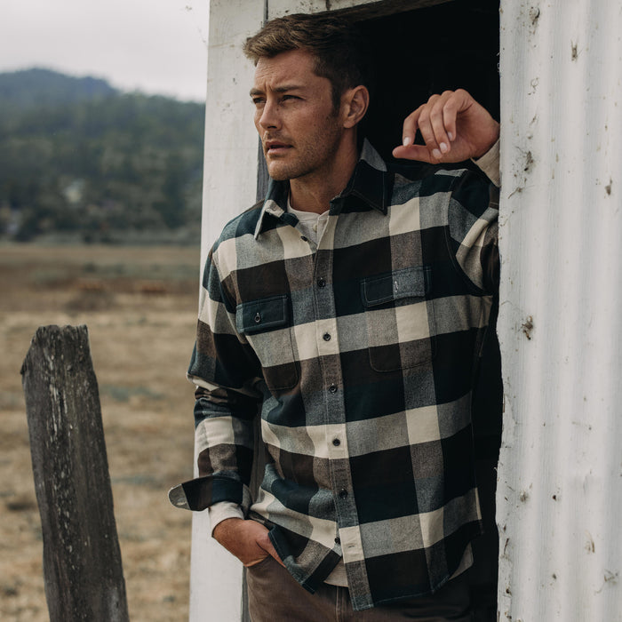fit model standing in a doorway in The Yosemite Shirt in Evergreen Check