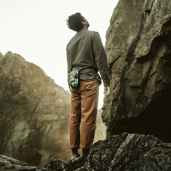 Our fit model preparing to rock climb in Yosemite Shirt in Heather Charcoal