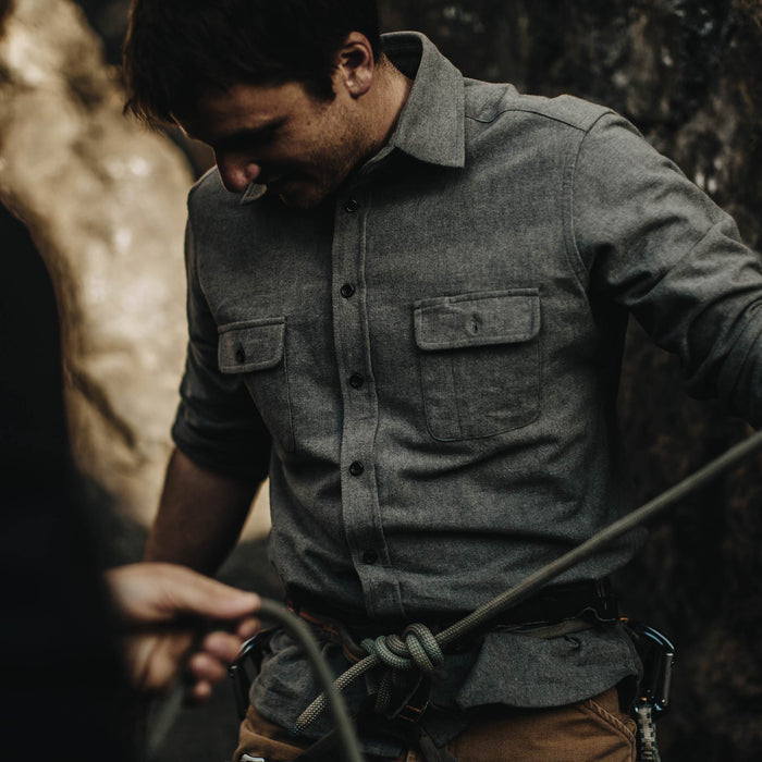 The fit model wearing Yosemite Shirt in Heather Charcoal and getting ready to climb