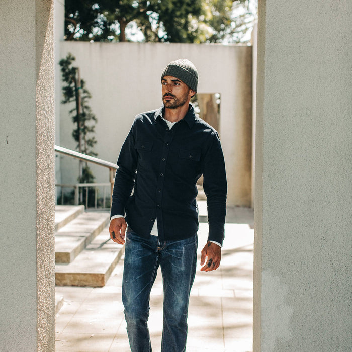fit model wearing The Yosemite Shirt in Midnight, looking left