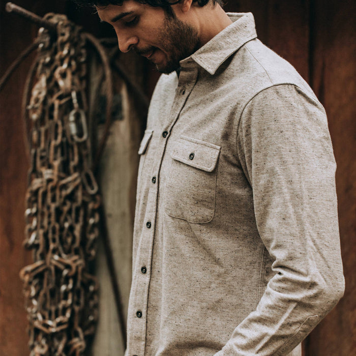 fit model wearing The Yosemite Shirt in Oat Donegal—looking down