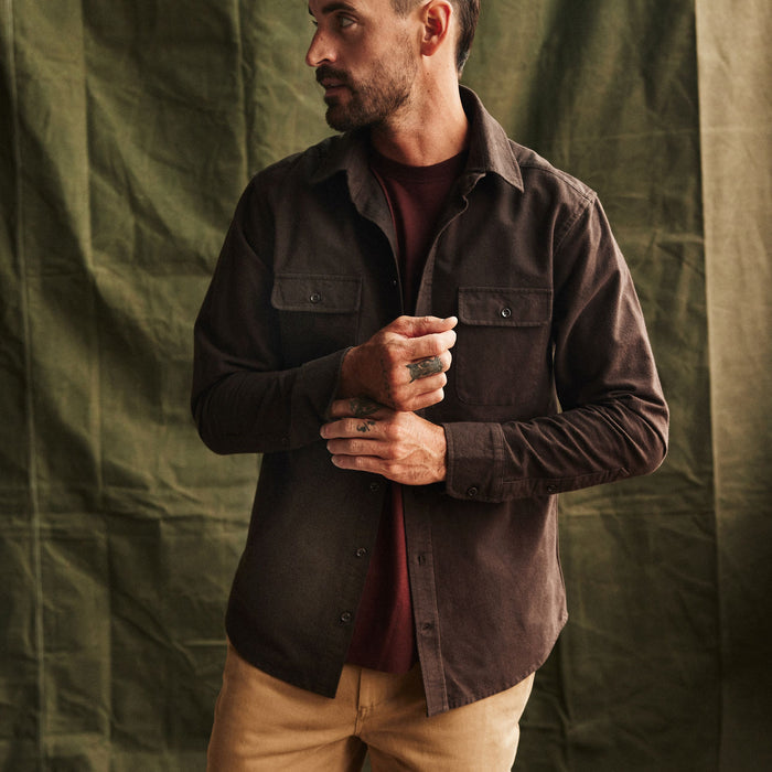 fit model adjusting the cuffs on The Yosemite Shirt in Soil