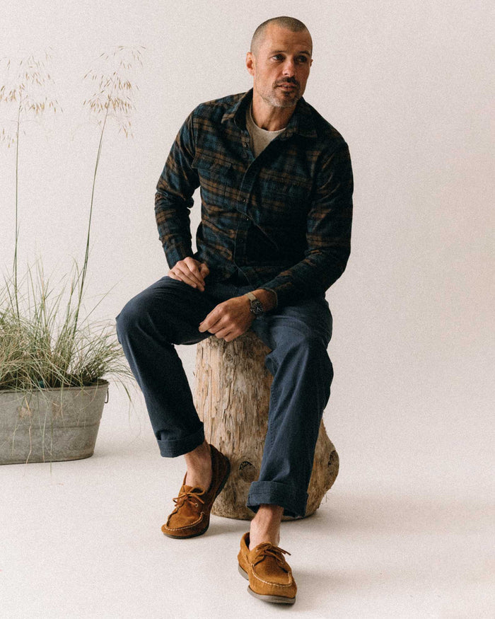 fit model sitting wearing The Yosemite Shirt in Wetlands Plaid