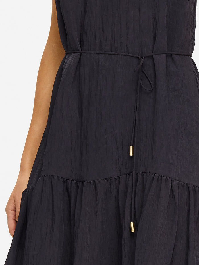 KIVARI Umi Maxi Dress in Charcoal – close-up detail of drawstring waist with gold hardware on women's charcoal tiered maxi dress